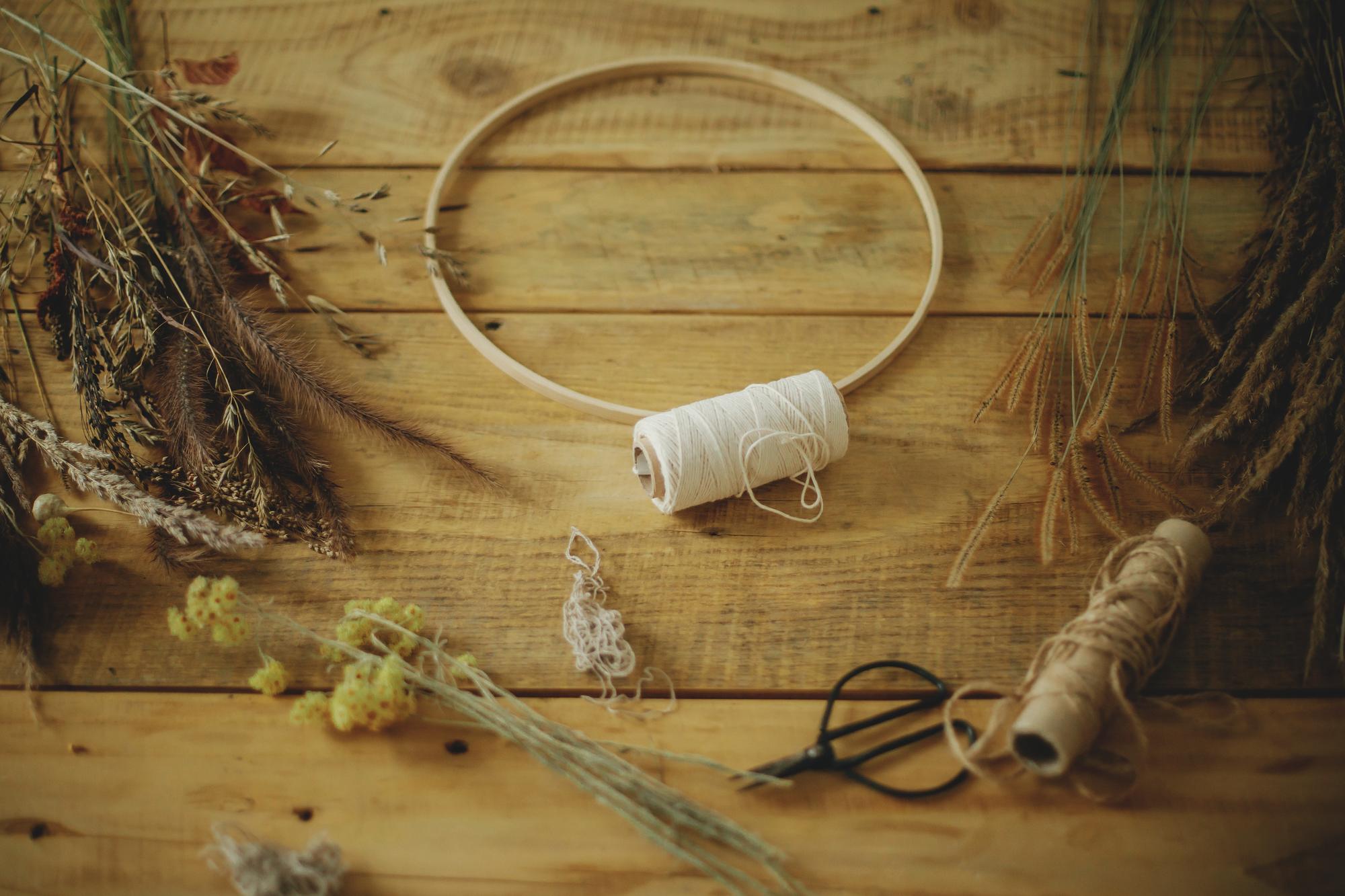 Artisan at work with hoop and gold thread